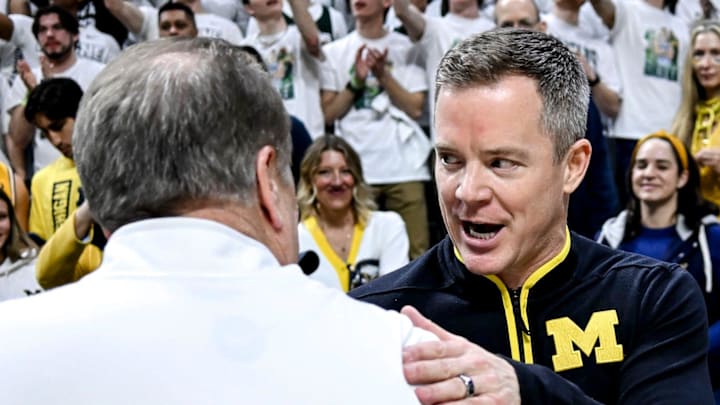 Michigan State's head coach Tom Izzo, left, and Michigan's head coach Dusty May shake hands before the game on Sunday, March 9, 2025, at the Breslin Center in East Lansing. Michigan State's head coach Tom Izzo, left, and Michigan's head coach Dusty May shake hands before the game on Sunday, March 9, 2025, at the Breslin Center in East Lansing.