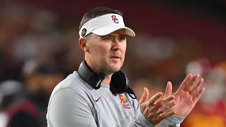 Oct 1, 2022; Los Angeles, California, USA;  USC Trojans head coach Lincoln Riley applauds after a touchdown in the first half against the Arizona State Sun Devils at United Airlines Field at the Los Angeles Memorial Coliseum. Mandatory Credit: Jayne Kamin-Oncea-Imagn Images