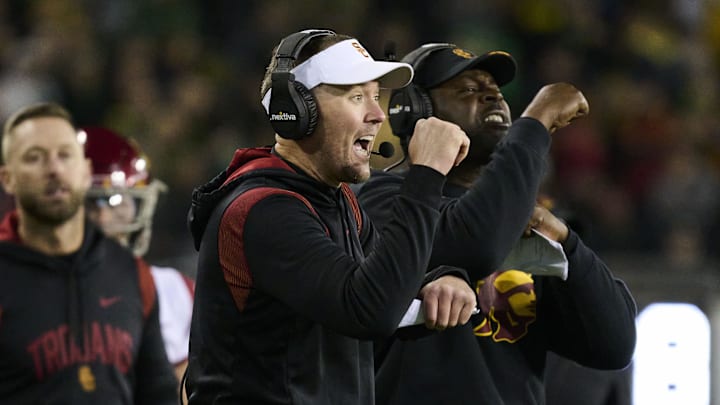 Nov 11, 2023; Eugene, Oregon, USA; USC Trojans head coach Lincoln Riley signals to the offense during the second half against the Oregon Ducks at Autzen Stadium. Mandatory Credit: Troy Wayrynen-Imagn Images