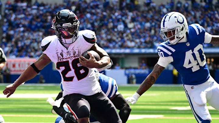 Sep 8, 2024; Indianapolis, Indiana, USA; Houston Texans running back Joe Mixon (28) runs the ball in for a touchdown in front of Indianapolis Colts cornerback Jaylon Jones (40) during the second half at Lucas Oil Stadium. Mandatory Credit: Marc Lebryk-Imagn Images Sep 8, 2024; Indianapolis, Indiana, USA; Houston Texans running back Joe Mixon (28) runs the ball in for a touchdown in front of Indianapolis Colts cornerback Jaylon Jones (40) during the second half at Lucas Oil Stadium. Mandatory Credit: Marc Lebryk-Imagn Images