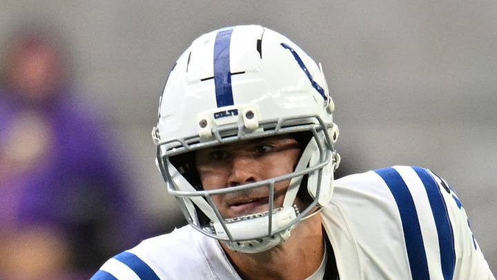 Indianapolis Colts quarterback Daniel Jones avoids a tackle