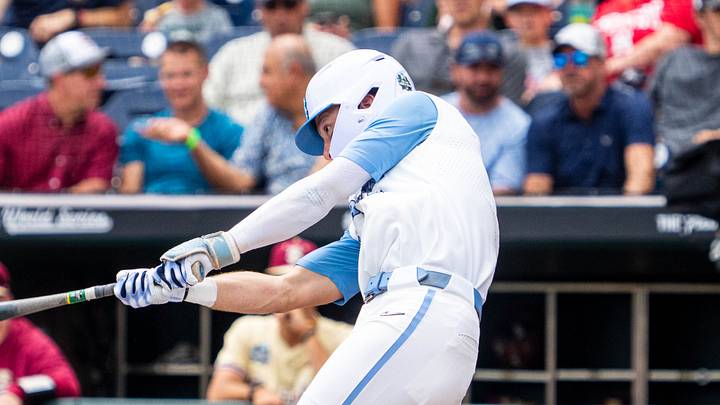 Jun 18, 2024; Omaha, NE, USA; North Carolina Tar Heels center fielder Vance Honeycutt (7) hits a double against the Florida State Seminoles during the third inning at Charles Schwab Field Omaha. Mandatory Credit: Dylan Widger-USA TODAY Sports