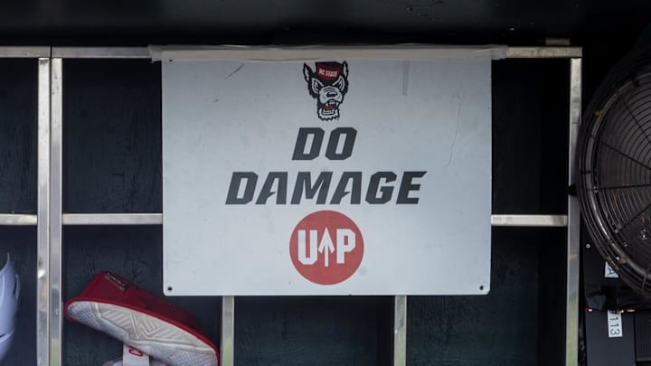 Jun 17, 2024; Omaha, NE, USA; NC State Wolfpack shortstop Brandon Butterworth (3) walks through the dugout before the game against the Florida Gators at Charles Schwab Field Omaha. Mandatory Credit: Dylan Widger-Imagn Images