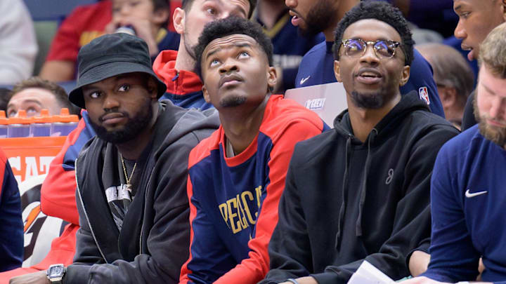 Jan 15, 2025; New Orleans, Louisiana, USA; New Orleans Pelicans forward Zion Williamson, left, center Yves Missi, and forward Herbert Jones (2) watch from the bench during the second half against the Dallas Mavericks at Smoothie King Center. Mandatory Credit: Matthew Hinton-Imagn Images