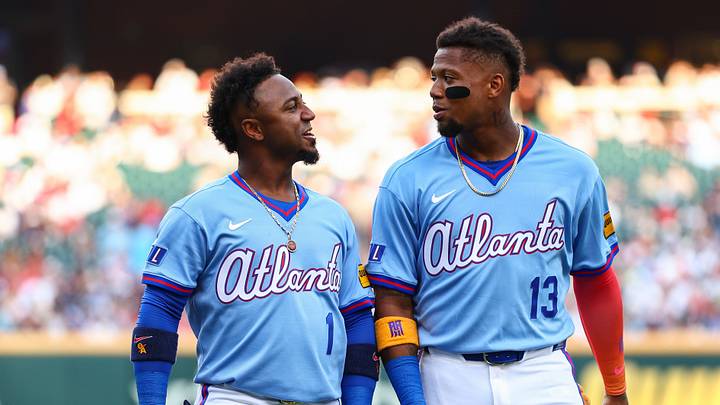 Aug 15, 2026; Cumberland, Georgia, USA; Atlanta Braves second baseman Ozzie Albies (1) and right fielder Ronald Acuña Jr. (13) react before a game against the Arizona Diamondbacks at Truist Park. Mandatory Credit: Colin Hubbard-Imagn Images