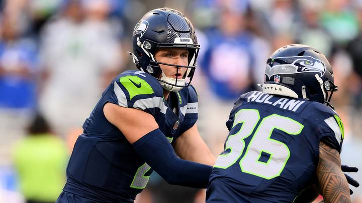 Sep 9, 2026; Seattle, Washington, USA; Seattle Seahawks quarterback Drew Lock (2) hands off to running back George Holani (36) during the first quarter against the New England Patriots at Lumen Field. Mandatory Credit: Steven Bisig-Imagn Images Sep 9, 2026; Seattle, Washington, USA; Seattle Seahawks quarterback Drew Lock (2) hands off to running back George Holani (36) during the first quarter against the New England Patriots at Lumen Field. Mandatory Credit: Steven Bisig-Imagn Images
