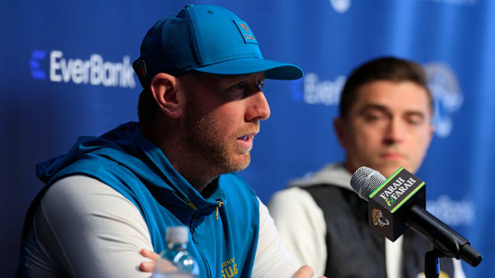 Jacksonville Jaguars head coach Liam Coen speaks during a press conference as general manager James Gladstone looks on at the Miller Electric Center, Wednesday, Jan. 14, 2026, in Jacksonville, Fla.