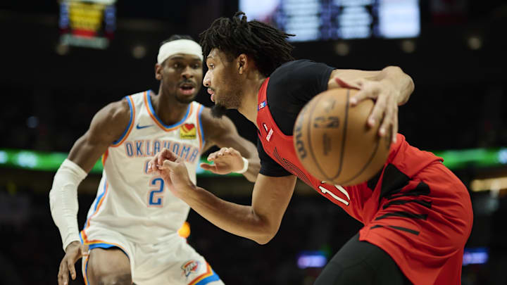 Jan 26, 2025; Portland, Oregon, USA; Portland Trail Blazers guard Shaedon Sharpe (17) drives to the basket during the first half against Oklahoma City Thunder guard Shai Gilgeous-Alexander (2) at Moda Center. Mandatory Credit: Troy Wayrynen-Imagn Images Jan 26, 2025; Portland, Oregon, USA; Portland Trail Blazers guard Shaedon Sharpe (17) drives to the basket during the first half against Oklahoma City Thunder guard Shai Gilgeous-Alexander (2) at Moda Center. Mandatory Credit: Troy Wayrynen-Imagn Images