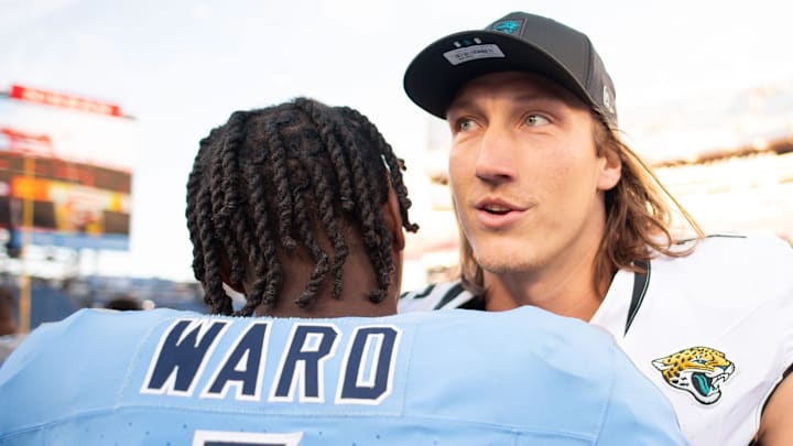 Nov 30, 2025; Nashville, Tennessee, USA;  Tennessee Titans quarterback Cameron Ward (1) and Jacksonville Jaguars quarterback Trevor Lawrence (16) during the second half at Nissan Stadium. Mandatory Credit: Steve Roberts-Imagn Images