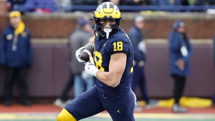 Oct 14, 2023; Ann Arbor, Michigan, USA; Michigan Wolverines tight end Colston Loveland (18) runs the ball in the first half against the Indiana Hoosiers at Michigan Stadium. 