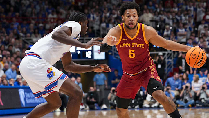Jan 13, 2026; Lawrence, Kansas, USA; Iowa State Cyclones forward Joshua Jefferson (5) drives against Kansas Jayhawks forward Flory Bidunga (40) during the first half at Allen Fieldhouse. Jan 13, 2026; Lawrence, Kansas, USA; Iowa State Cyclones forward Joshua Jefferson (5) drives against Kansas Jayhawks forward Flory Bidunga (40) during the first half at Allen Fieldhouse.