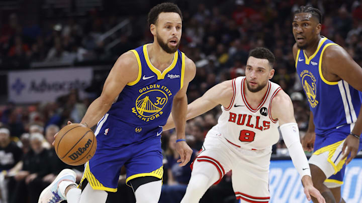 Jan 12, 2024; Chicago, Illinois, USA; Golden State Warriors guard Stephen Curry (30) dribbles against Chicago Bulls guard Zach LaVine (8) during the first half at United Center. Mandatory Credit: Kamil Krzaczynski-Imagn Images