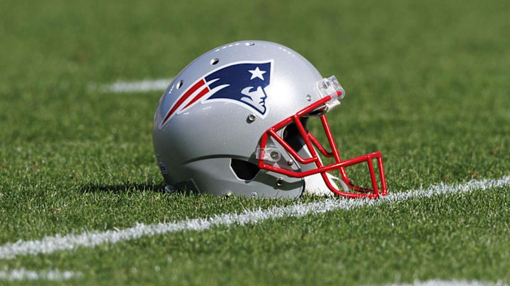 Oct 2, 2022; Green Bay, Wisconsin, USA; A New England Patriots helmet sits on the field during warmups prior to the game against the Green Bay Packers at Lambeau Field. Mandatory Credit: Jeff Hanisch-Imagn Images Oct 2, 2022; Green Bay, Wisconsin, USA; A New England Patriots helmet sits on the field during warmups prior to the game against the Green Bay Packers at Lambeau Field. Mandatory Credit: Jeff Hanisch-Imagn Images