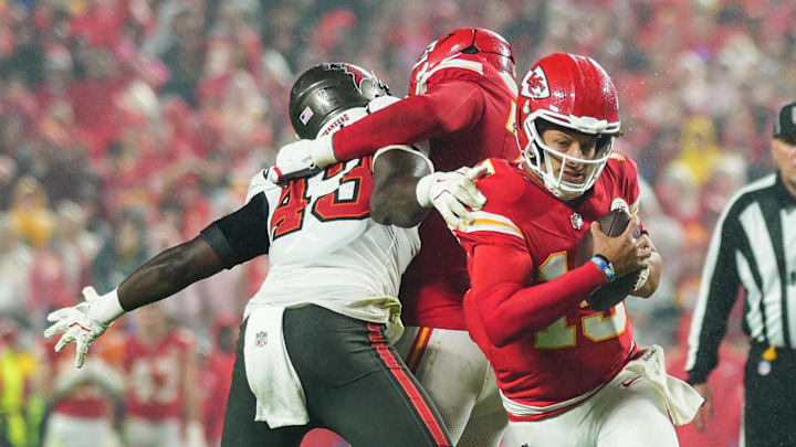 Nov 4, 2024; Kansas City, Missouri, USA; Kansas City Chiefs quarterback Patrick Mahomes (15) scrambles against Tampa Bay Buccaneers linebacker Chris Braswell (43) during the second half at GEHA Field at Arrowhead Stadium. Mandatory Credit: Jay Biggerstaff-Imagn Images