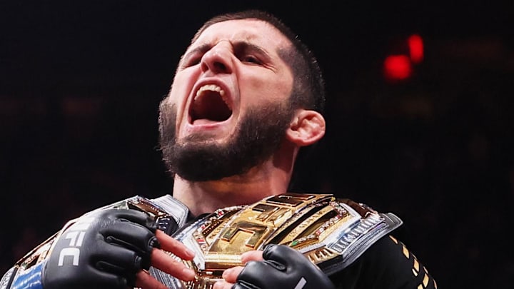 Nov 15, 2025; New York, NY, UNITED STATES; Islam Makhachev (blue gloves) celebrates after defeating Jack Della Maddalena (not pictured) by unanimous decision in the welterweight championship bout during UFC 322 at Madison Square Garden. Mandatory Credit: Ed Mulholland-Imagn Images
