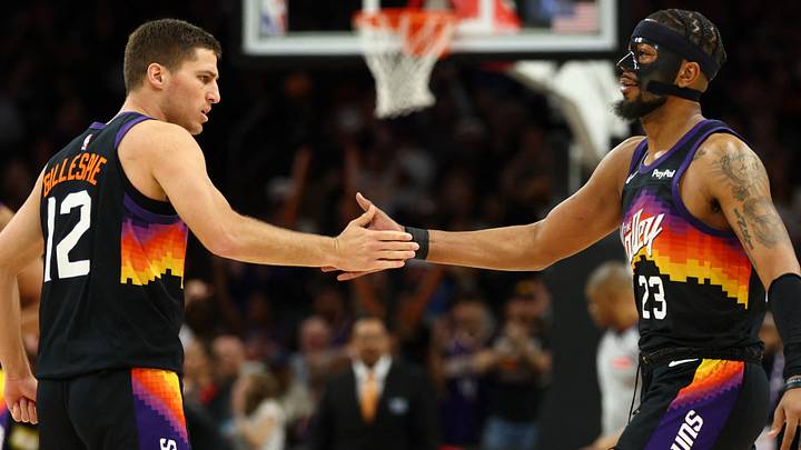Feb 21, 2026; Phoenix, Arizona, USA; Phoenix Suns guard Collin Gillespie (12) celebrates with Jordan Goodwin (23) against the Orlando Magic in the second half at Mortgage Matchup Center. Mandatory Credit: Mark J. Rebilas-Imagn Images Feb 21, 2026; Phoenix, Arizona, USA; Phoenix Suns guard Collin Gillespie (12) celebrates with Jordan Goodwin (23) against the Orlando Magic in the second half at Mortgage Matchup Center. Mandatory Credit: Mark J. Rebilas-Imagn Images