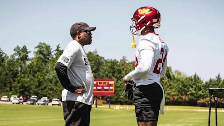 Washington Commanders defensive coordinator Joe Whitt Jr. and outside linebacker Von Miller.