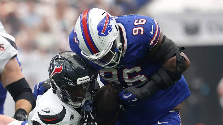 Sep 13, 2026; Houston, Texas, USA;  Buffalo Bills defensive tackle Deone Walker (96) tackles Houston Texans running back Woody Marks (4) during the first half at Reliant Stadium.  Mandatory Credit: Thomas Shea-Imagn Images