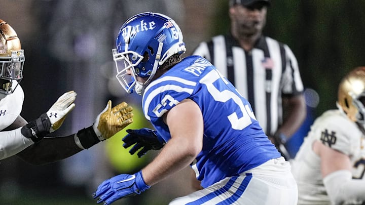 Sep 30, 2023; Durham, North Carolina, USA; Notre Dame Fighting Irish defensive lineman Nana Osafo-Mensah (31) against Duke Blue Devils offensive lineman Brian Parker II (53) during the second half at Wallace Wade Stadium. Mandatory Credit: Jim Dedmon-Imagn Images