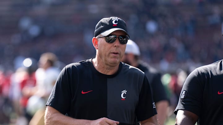 Cincinnati Bearcats head coach Scott Satterfield walks off the field after the NCAA football game between the Cincinnati Bearcats and UCF Knights at Nippert Stadium in Cincinnati on Oct. 11, 2025. Cincinnati Bearcats head coach Scott Satterfield walks off the field after the NCAA football game between the Cincinnati Bearcats and UCF Knights at Nippert Stadium in Cincinnati on Oct. 11, 2025.