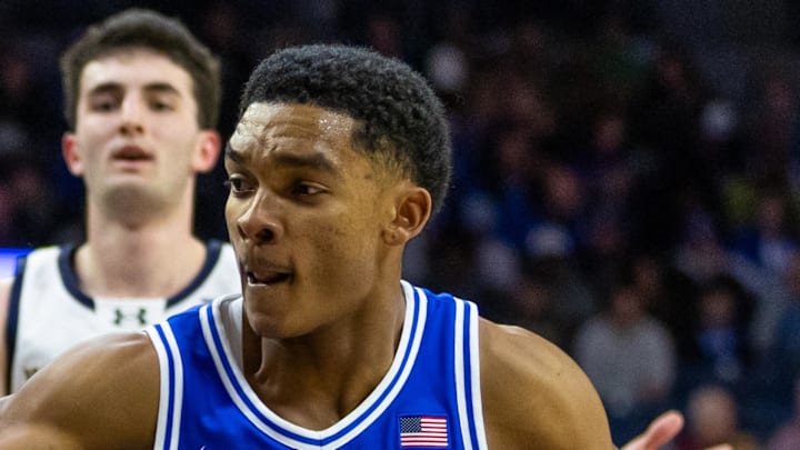Feb 24, 2026; South Bend, Indiana, USA; Duke Blue Devils guard Caleb Foster (1) drives as Notre Dame Fighting Irish guard Sir Mohammed (13) defends during the second half at Purcell Pavilion at the Joyce Center. Mandatory Credit: Michael Caterina-Imagn Images