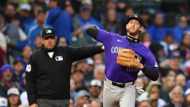 May 27, 2025; Chicago, Illinois, USA; Colorado Rockies third baseman Ryan McMahon (24) throws during a game against the Chicago Cubs at Wrigley Field.