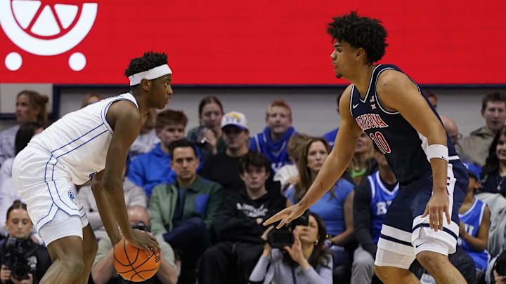 Jan 26, 2026; Provo, Utah, USA; Arizona Wildcats forward Koa Peat (10) defends BYU Cougars forward AJ Dybantsa (3) during the second half at Marriott Center. Mandatory Credit: Aaron Baker-Imagn Images 