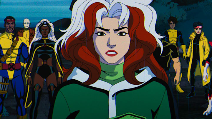 (L-R): Beast (voiced by George Buza), Forge (voiced by Gil Birmingham), Morph (voiced by JP Karliak), Storm (voiced by Alison Sealy-Smith), Rogue (voiced by Lenore Zann), Wolverine (voiced by Cal Dodd), Roberto Da Costa (voiced by Gui Agustini), Jubilee (voiced by Holly Chou), and Nightcrawler (voiced by Adrian Hough) in Marvel Animation's X-MEN '97. Photo courtesy of Marvel Animation. © 2024 MARVEL.