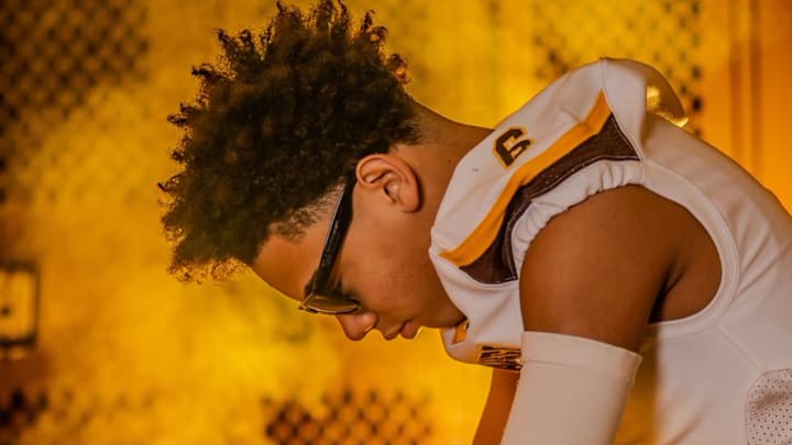 Nebraska Cornhuskers commit Trae Taylor with glasses on in his media photos with his high school