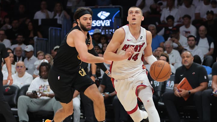 Apr 26, 2025; Miami, Florida, USA; Miami Heat guard Tyler Herro (14) drives to the basket past Cleveland Cavaliers guard Max Strus (1) in the third quarter during game three for the first round of the 2025 NBA Playoffs at Kaseya Center. Mandatory Credit: Sam Navarro-Imagn Images Apr 26, 2025; Miami, Florida, USA; Miami Heat guard Tyler Herro (14) drives to the basket past Cleveland Cavaliers guard Max Strus (1) in the third quarter during game three for the first round of the 2025 NBA Playoffs at Kaseya Center. Mandatory Credit: Sam Navarro-Imagn Images