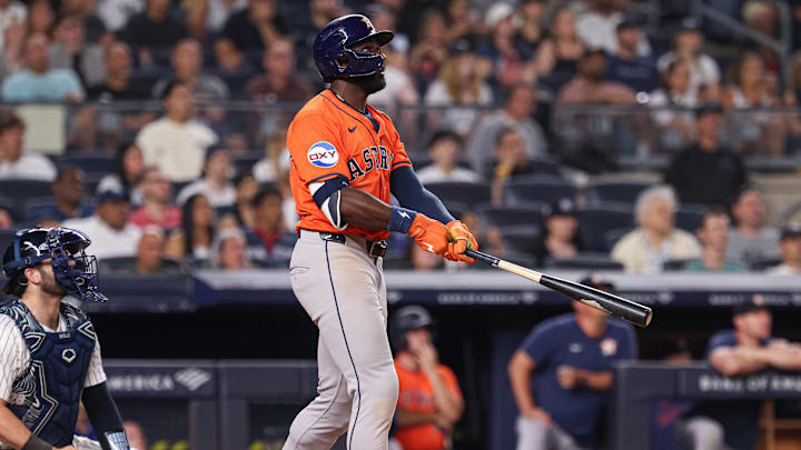 Aug 8, 2025; Bronx, New York, USA; Houston Astros left fielder Taylor Trammell (26) hits a two run home run during the tenth inning against the New York Yankees at Yankee Stadium. Mandatory Credit: Vincent Carchietta-Imagn Images