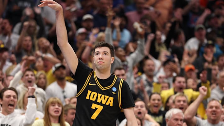 Mar 22, 2026; Tampa, FL, USA; Iowa Hawkeyes forward Alvaro Folgueiras (7) makes a go-ahead three-point basket against the Florida Gators late in the second half during a second round game of the men's 2026 NCAA Tournament at Benchmark International Arena. 