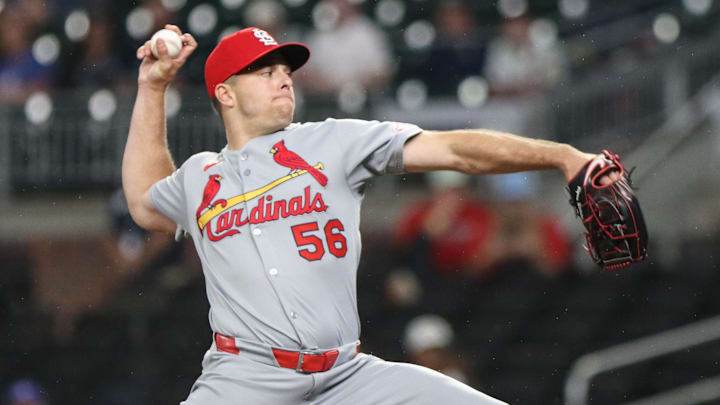 Apr 22, 2025; Cumberland, Georgia, USA; St. Louis Cardinals pitcher Ryan Helsley (56) pitches the ball against the Atlanta Braves during the ninth inning at Truist Park. 