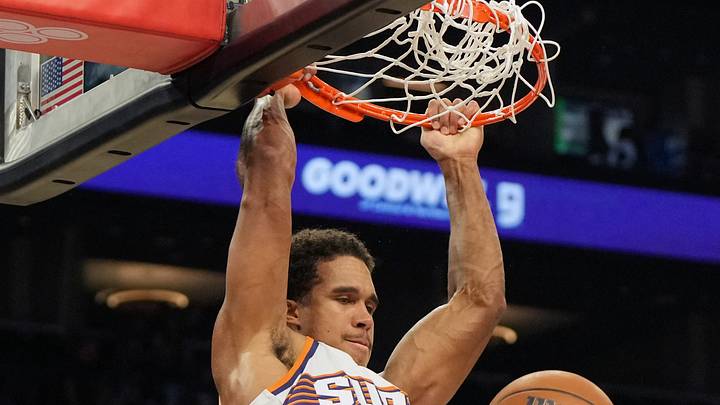 Oct 10, 2026; Phoenix, Arizona, USA; Phoenix Suns forward Oso Ighodaro (11) dunks against San Antonio Spurs forward Victor Wembanyama (1) in the first half at Mortgage Matchup Center. Mandatory Credit: Rick Scuteri-Imagn Images Oct 10, 2026; Phoenix, Arizona, USA; Phoenix Suns forward Oso Ighodaro (11) dunks against San Antonio Spurs forward Victor Wembanyama (1) in the first half at Mortgage Matchup Center. Mandatory Credit: Rick Scuteri-Imagn Images