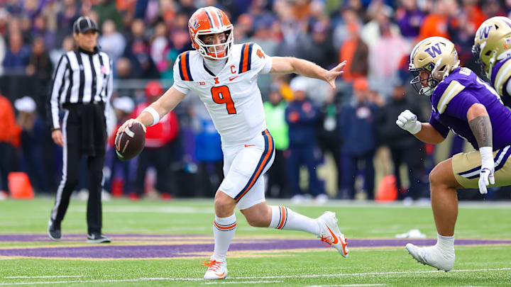 Illinois quarterback Luke Altymer (9) scrambles to escape a defender in the Illini's 42-25 loss to Washington on Saturday in Seattle. Illinois quarterback Luke Altymer (9) scrambles to escape a defender in the Illini's 42-25 loss to Washington on Saturday in Seattle.