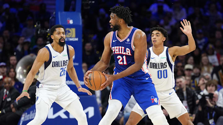 Feb 4, 2025; Philadelphia, Pennsylvania, USA; Philadelphia 76ers center Joel Embiid (21) controls the ball against Dallas Mavericks guard Spencer Dinwiddie (26) and guard Max Christie (00) in the second quarter at Wells Fargo Center. Mandatory Credit: Kyle Ross-Imagn Images