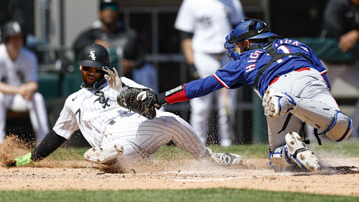 Texas Rangers catcher Kyle Higashioka (11) tags out Chicago White Sox catcher Edgar Quero (7) at Rate Field. 
