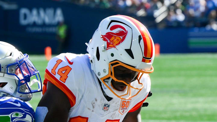Seattle Seahawks safety Ty Okada breaks up a pass to Tampa Bay Buccaneers wide receiver Chris Godwin.