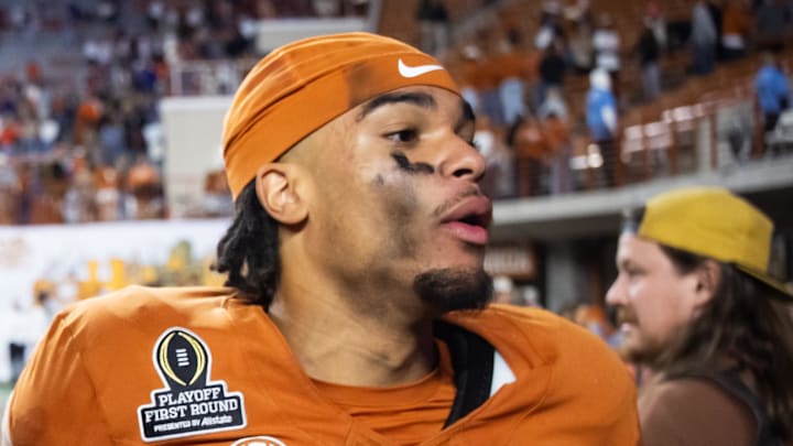 Dec 21, 2024; Austin, Texas, USA; Texas Longhorns offensive lineman Malik Agbo (80) celebrates with wide receiver DeAndre Moore Jr. (0) after defeating the Clemson Tigers during the CFP National playoff first round at Darrell K Royal-Texas Memorial Stadium. Mandatory Credit: Mark J. Rebilas-Imagn Images