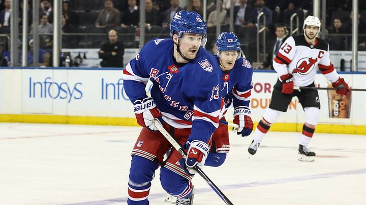 Mar 18, 2026; New York, New York, USA;  New York Rangers left wing Alexis Lafrenière (13) controls the puck in the third period against the New Jersey Devils at Madison Square Garden. Mandatory Credit: Wendell Cruz-Imagn Images