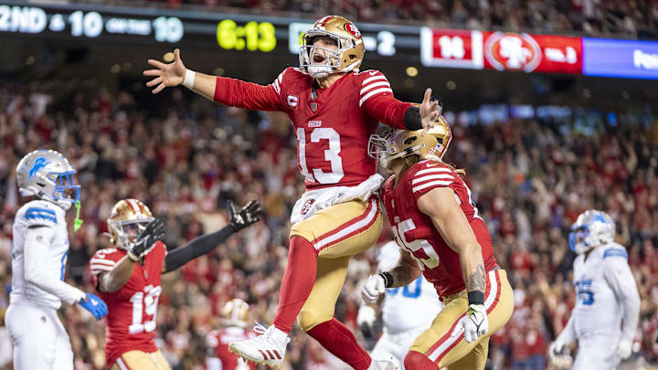 December 30, 2024; Santa Clara, California, USA; San Francisco 49ers quarterback Brock Purdy (13) celebrates with tight end George Kittle (85) after scoring a touchdown against the Detroit Lions during the second quarter at Levi's Stadium. Mandatory Credit: Kyle Terada-Imagn Images
