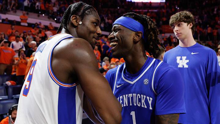 Feb 14, 2026; Gainesville, Florida, USA; Florida Gators center Rueben Chinyelu (9) and Kentucky Wildcats guard Denzel Aberdeen (1) embrace after a game at Exactech Arena at the Stephen C. O'Connell Center. Mandatory Credit: Matt Pendleton-Imagn Images