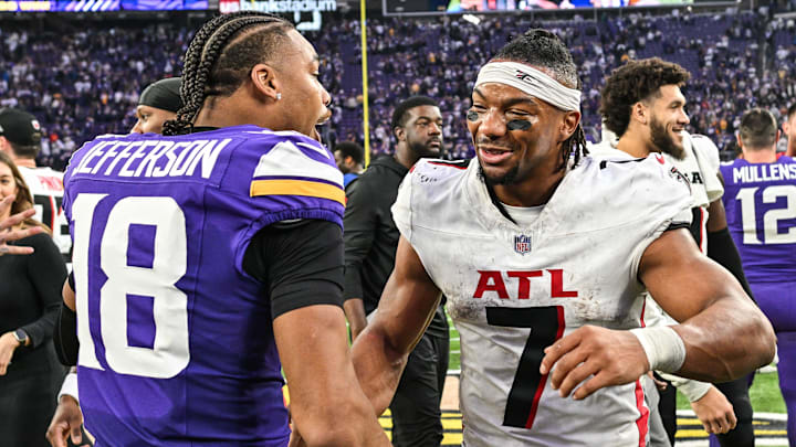 Dec 8, 2024; Minneapolis, Minnesota, USA; Atlanta Falcons running back Bijan Robinson (7) and Minnesota Vikings wide receiver Justin Jefferson (18) greet each other after the game at U.S. Bank Stadium.