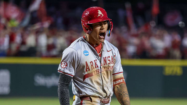 Arkansas shortstop Wehiwa Aloy slugged a home run and a triple off the center-field fence to fuel the Razorbacks' 7-3 win against UCLA on Tuesday. Arkansas shortstop Wehiwa Aloy slugged a home run and a triple off the center-field fence to fuel the Razorbacks' 7-3 win against UCLA on Tuesday.