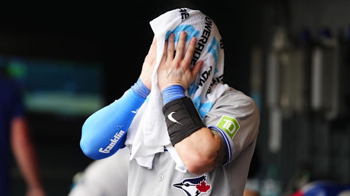 Aug 6, 2025; Denver, Colorado, USA; Toronto Blue Jays catcher Tyler Heineman (55) cools off in the sixth inning against the Colorado Rockies at Coors Field. 