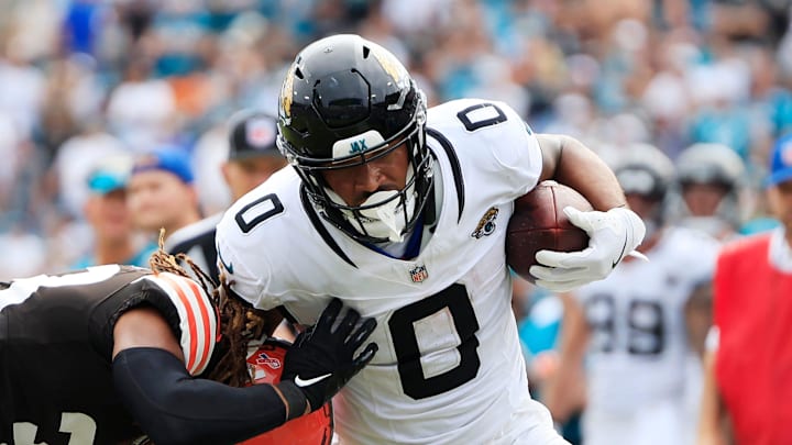 Cleveland Browns safety Ronnie Hickman (33) pushes Jacksonville Jaguars wide receiver Gabe Davis (0) out of bounds during the fourth quarter of an NFL football matchup Sunday, Sept. 15, 2024 at EverBank Stadium in Jacksonville, Fla. The Browns defeated the Jaguars 18-13. [Corey Perrine/Florida Times-Union]