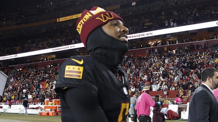 Oct 27, 2024; Landover, Maryland, USA;Washington Commanders quarterback Jayden Daniels (5) smiles while leaving the field after the Commanders' game against the Chicago Bears  at Northwest Stadium. Mandatory Credit: Geoff Burke-Imagn Images