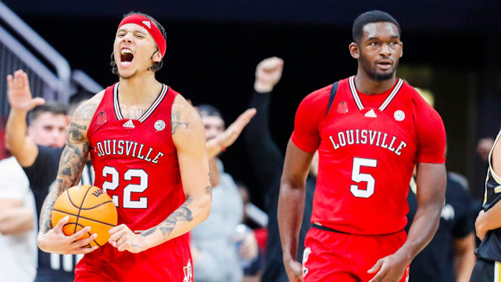 Louisville Cardinals guard Tre White (22) celebrates after the Cards edged UMBC 94-93 Monday night. Louisville Cardinals guard Tre White (22) celebrates after the Cards edged UMBC 94-93 Monday night.