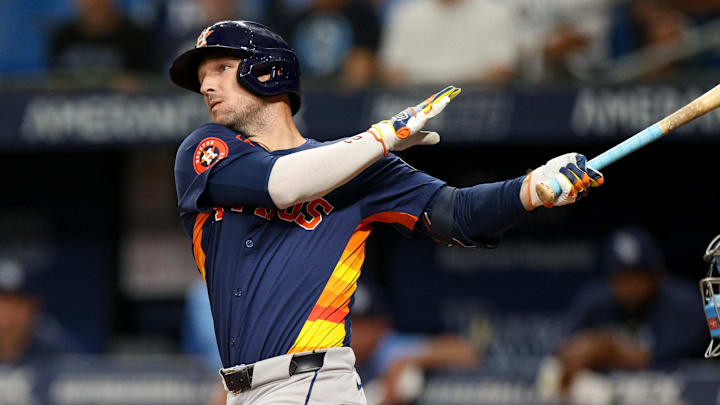 Aug 12, 2024; St. Petersburg, Florida, USA; Houston Astros third baseman Alex Bregman (2) hits a home run against the Tampa Bay Rays in the first inning  at Tropicana Field