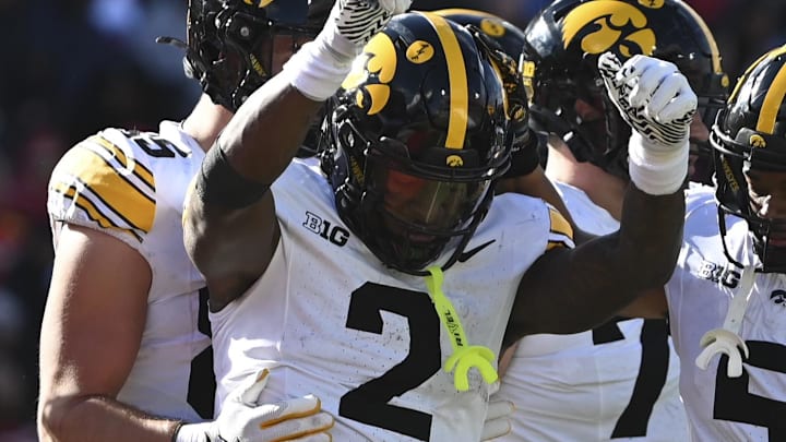 Nov 23, 2024; College Park, Maryland, USA; Iowa Hawkeyes running back Kaleb Johnson (2) celebrates after scoring a touchdown during the first half against the Maryland Terrapins at SECU Stadium. Mandatory Credit: Tommy Gilligan-Imagn Images Nov 23, 2024; College Park, Maryland, USA; Iowa Hawkeyes running back Kaleb Johnson (2) celebrates after scoring a touchdown during the first half against the Maryland Terrapins at SECU Stadium. Mandatory Credit: Tommy Gilligan-Imagn Images